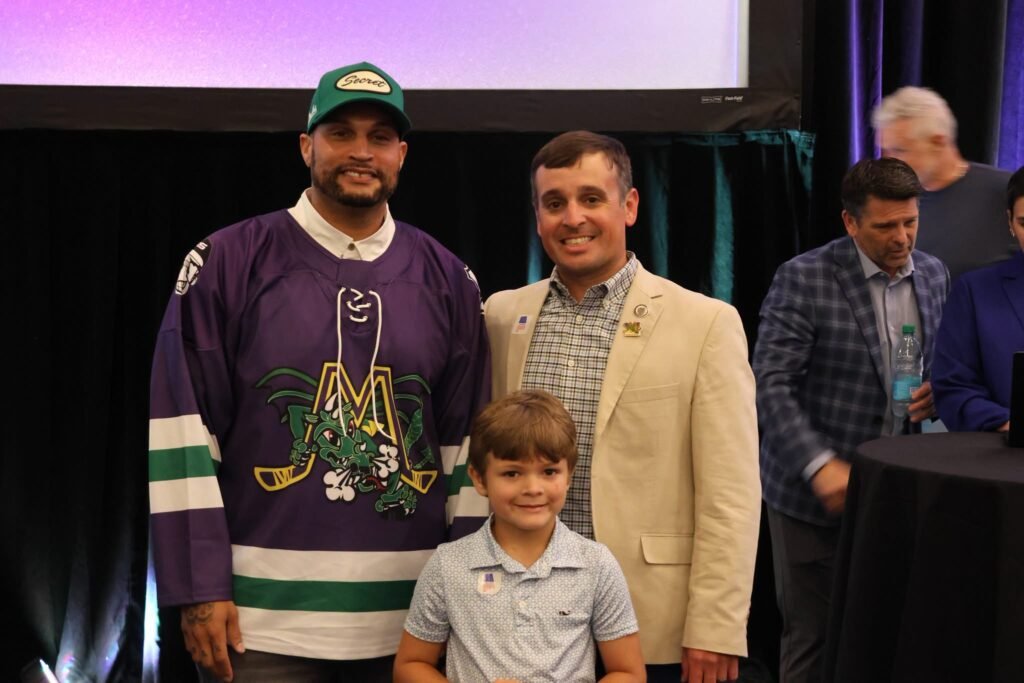 Tony Davis, District 6 Councilman Josh Woods, and young Mr. Woods At Mobile Mysticks name reveal ceremony.