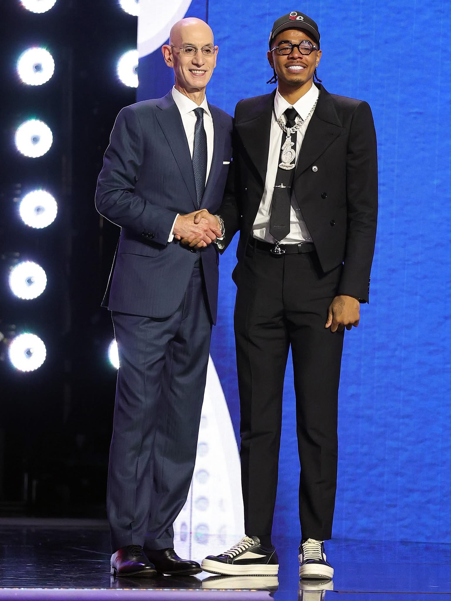 Labaron Philon Jr. shaking hands with NBA Commissioner Adam Silver on stage at the 2026 NBA Draft after being selected 22nd overall by the Sixers. 