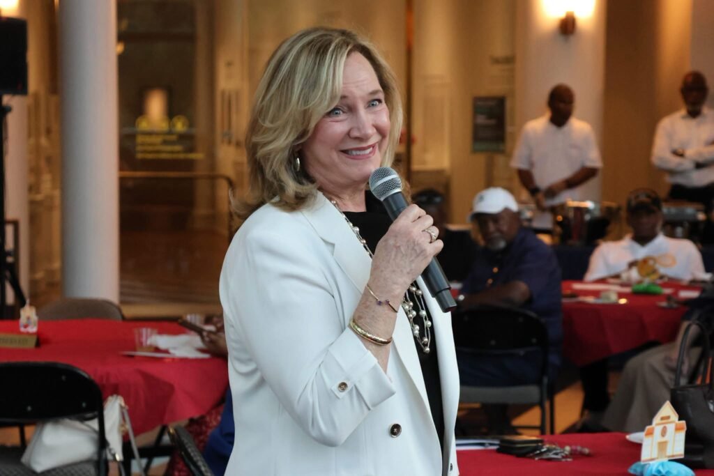 Gina Gregory, District 7 Council member, speaks to a crowd at the Back-to-School drive