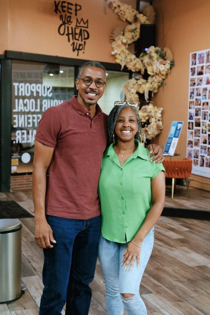 Community organizer Reggie Weaver and Great Day Latte owner Kimberly Knight pose for a photo during the event.