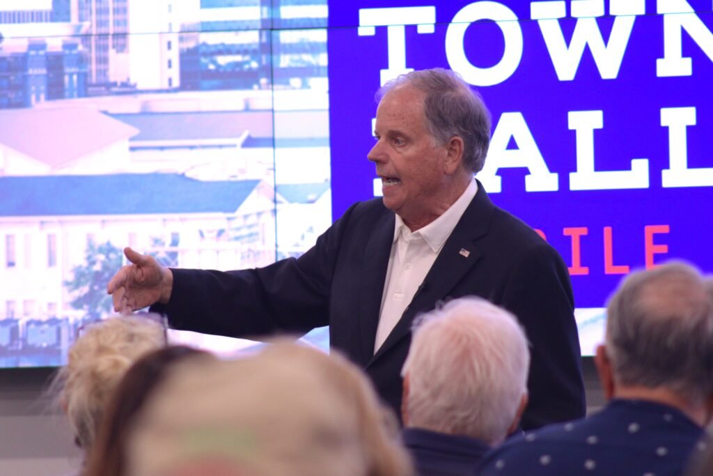 Doug Jones speaking to attendees at the Mobile town hall event.