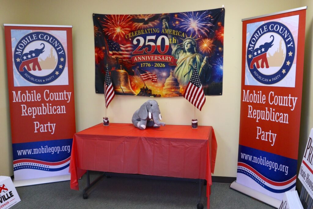 Interior view showing party banners and a decorated display table inside the headquarters.